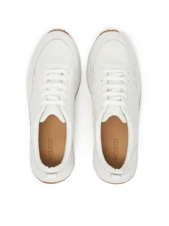 Białe sneakersy w monogramy z łączonych skór